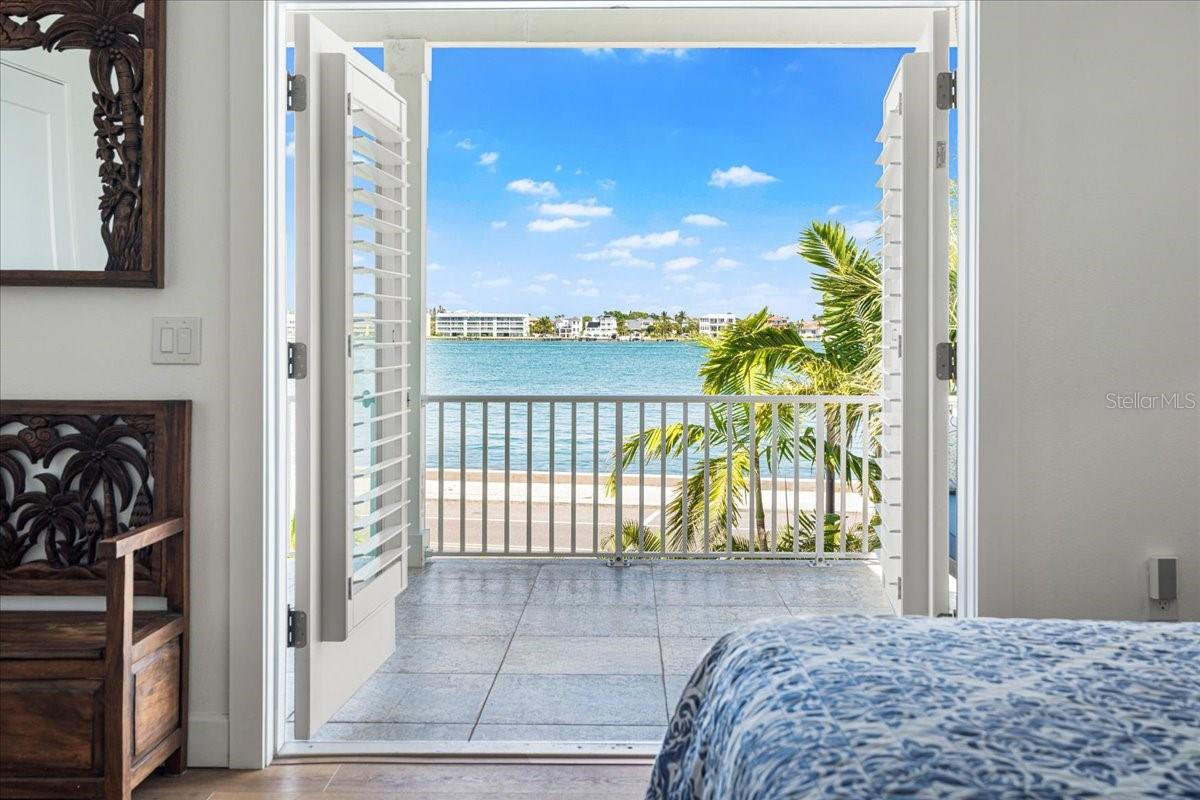 2nd Floor:  Primary Bedroom French Doors to Patio, sweeping water views, spectacular, your secret slice quietness...with a view