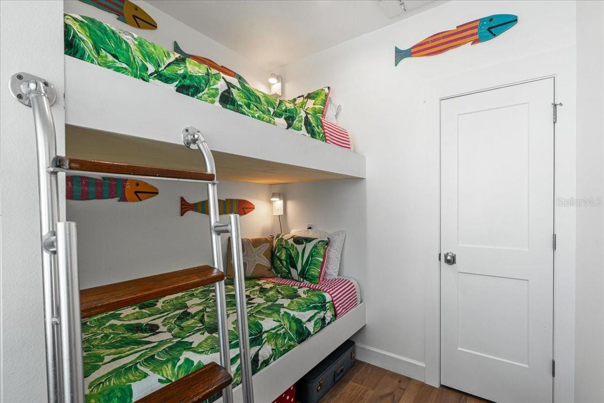 2nd Floor:  Fourth Bedroom, Closet, Adult Sized Bunk Beds, Custom Ladder repurposed from a boat another one of many unique features.