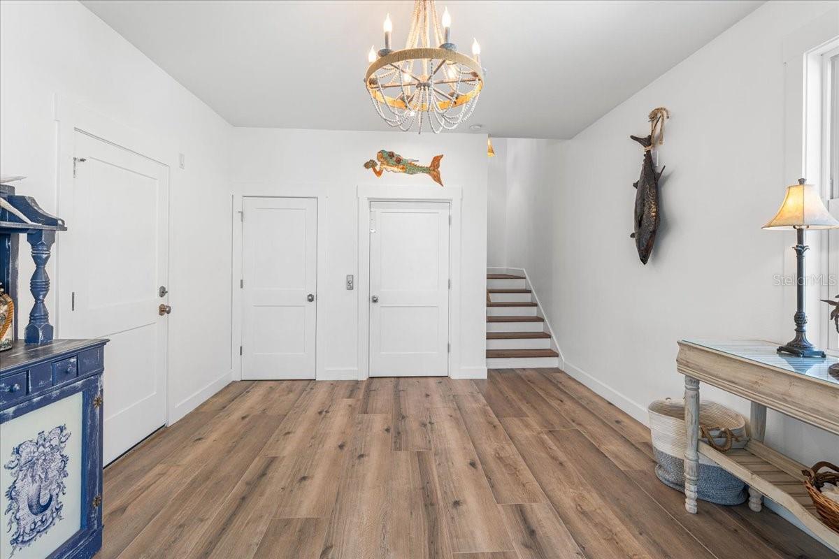 1st Floor: Foyer View from the front door entrance. Garage Entrance to the left, Elevator entrance and Storage Closet direct view, stairs from 2nd floor.