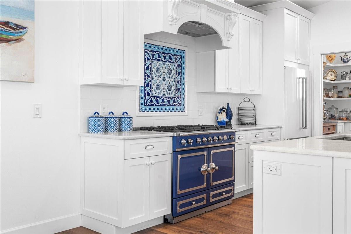 Oh yes, you Cooks, Foodies, Chefs, or lover of the color blue! High End Chef's Kitchen: La Cornue Gas Range, Designer Tiled Backsplash, "Pantry" Entrance next to Fridge, Pocket Door Versatility