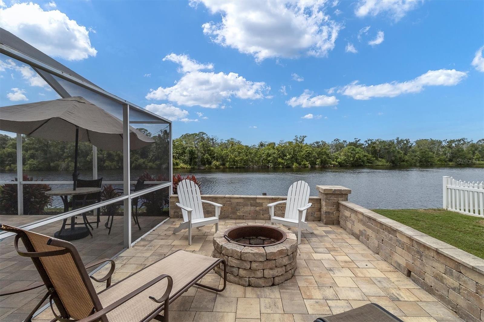 outside cage lanai area/fire pit