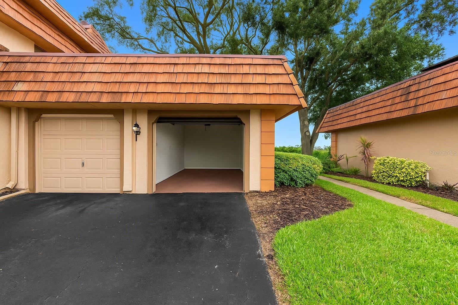 Private one-car garage — uncommon for lakeside homes in this community