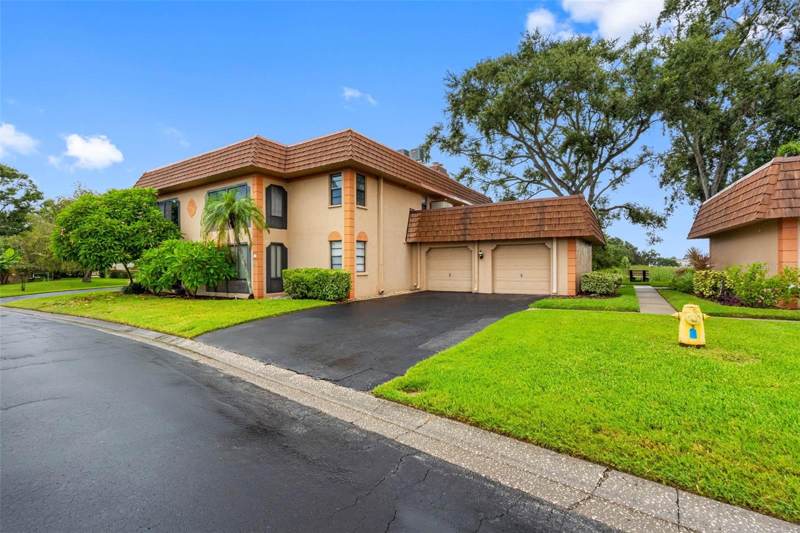 End unit with shared dock on Seminole Lake — enjoy direct lake access just steps from home