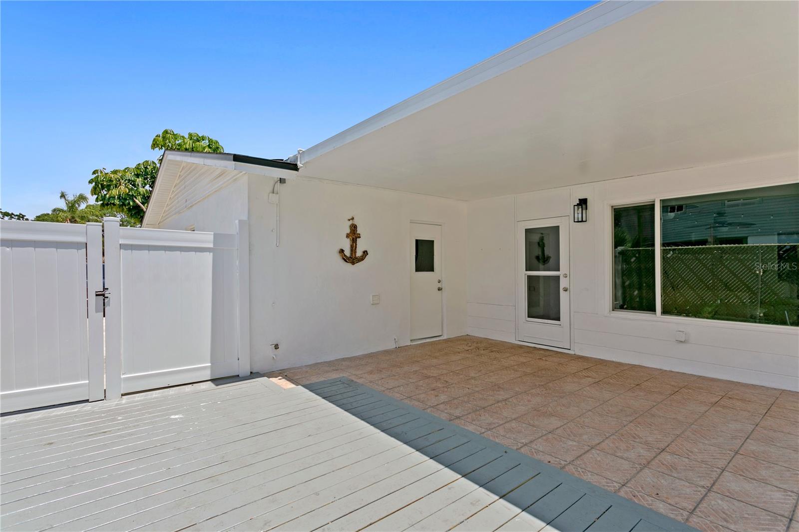 Uncovered lanai from side gate entrance