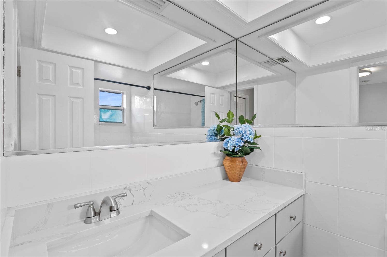 Upstairs shared bathroom with tub