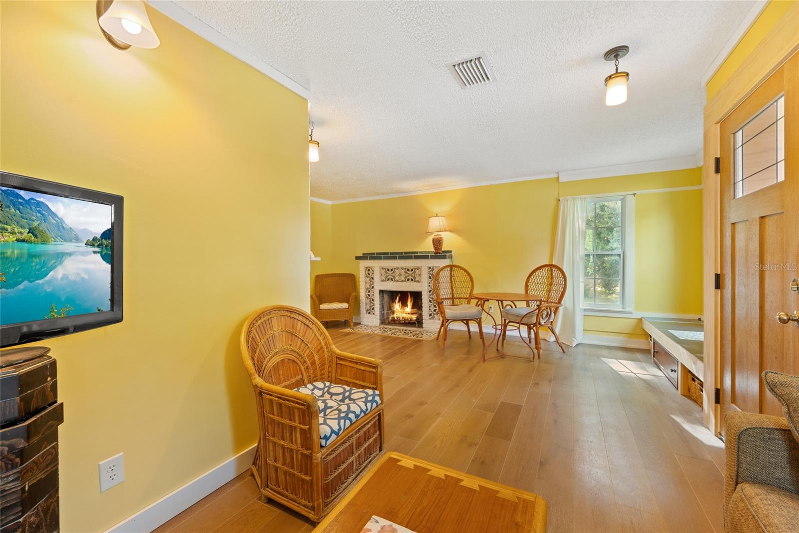 On the other side of the main living area you'll find a built in bench and the fireplace