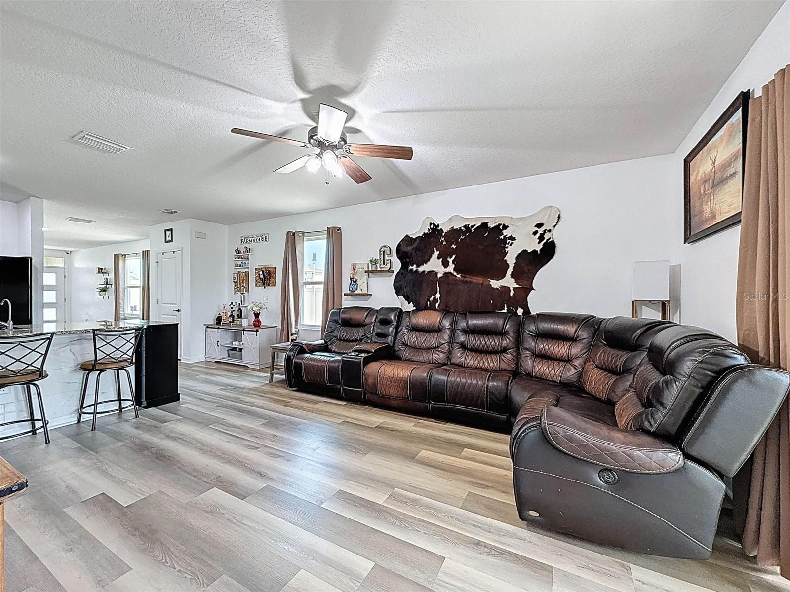 FAMILY ROOM SHARES SPACE WITH THE KITCHEN
