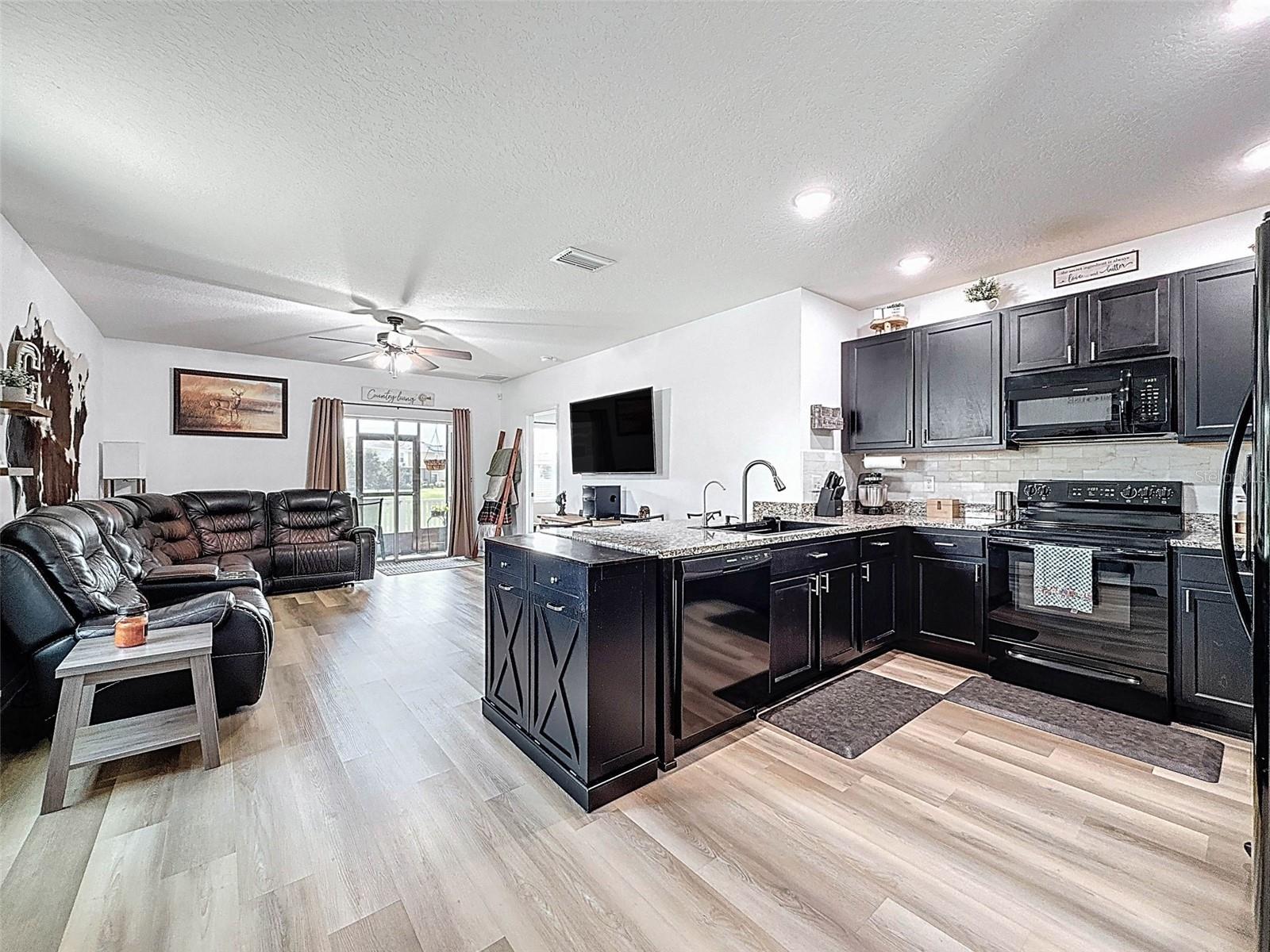 GOURMET KITCHEN WITH STAINLESS APPLIANCES AND MORE
