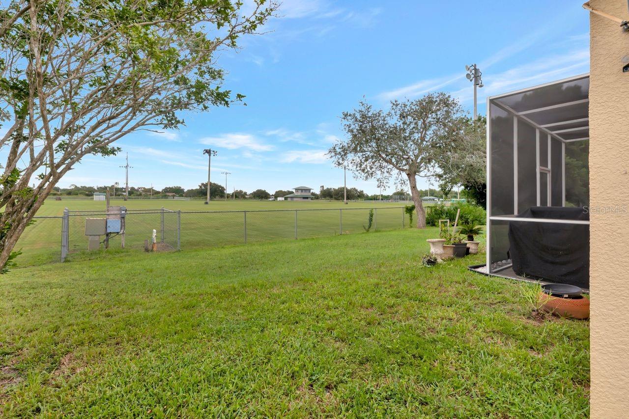 Back yard is backed to a socker field.