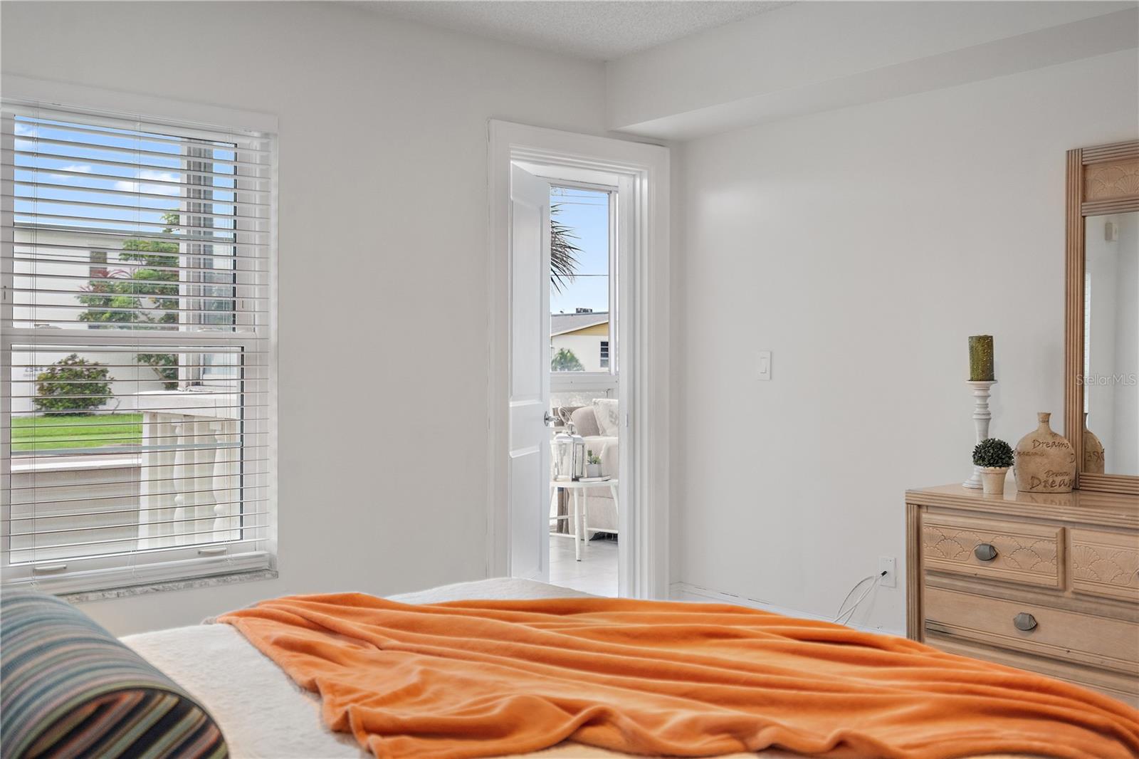Primary Bedroom has entrance to sunroom