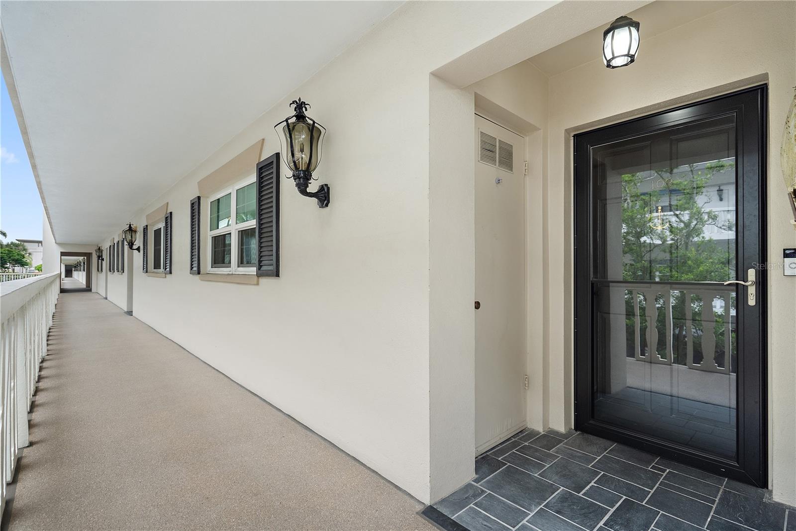 Utility storage outside condo - Holds AC & WH