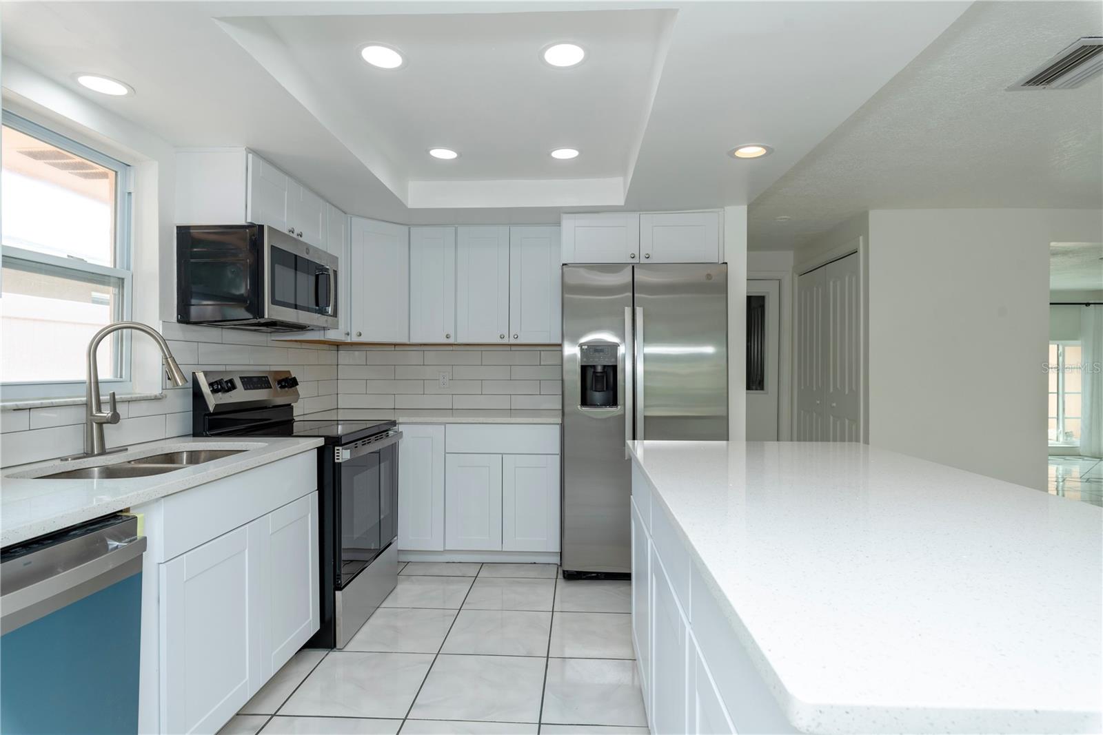 Kitchen with stainless steel appliances.