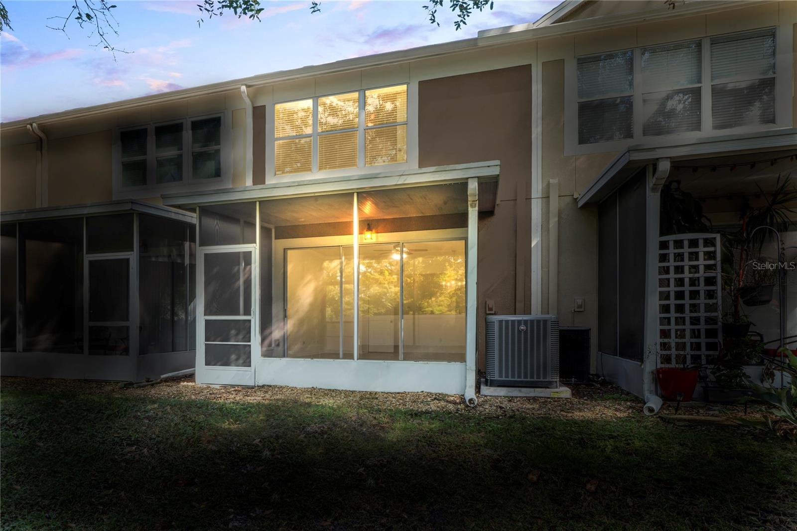 Lanai view of home at dusk