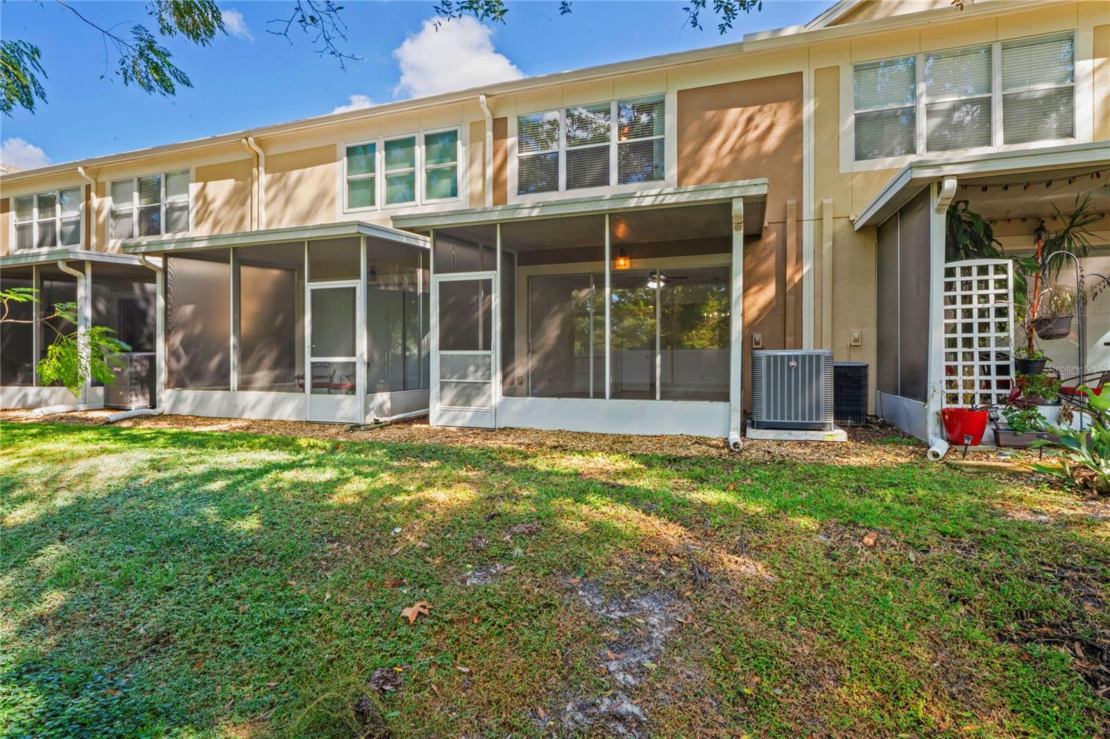 Lanai view of home from backyard side angle