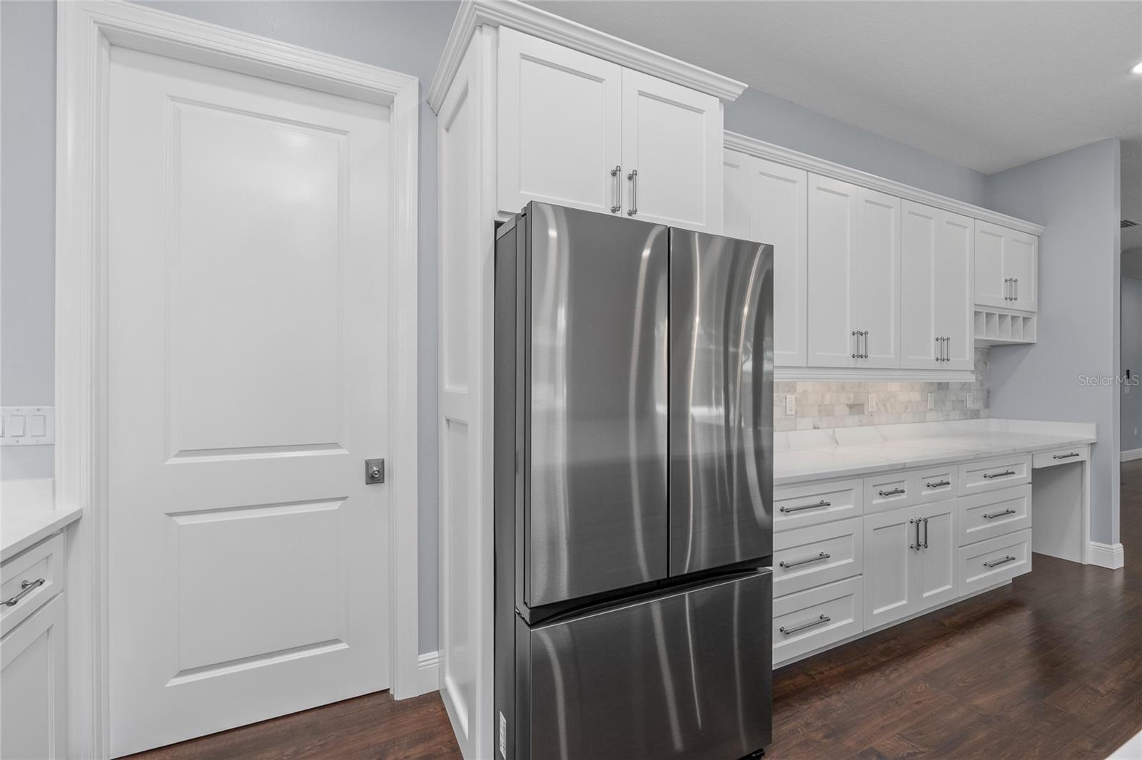 If this huge kitchen doesn't have enough storage for you, wait until you see the Pantry behind this beautiful door