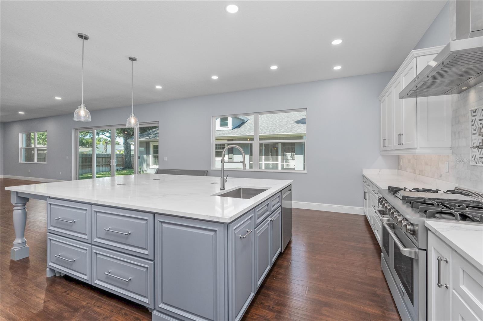 This thoughtful design has so much storage, these custom wood cabinets are topped with Quartz countertops