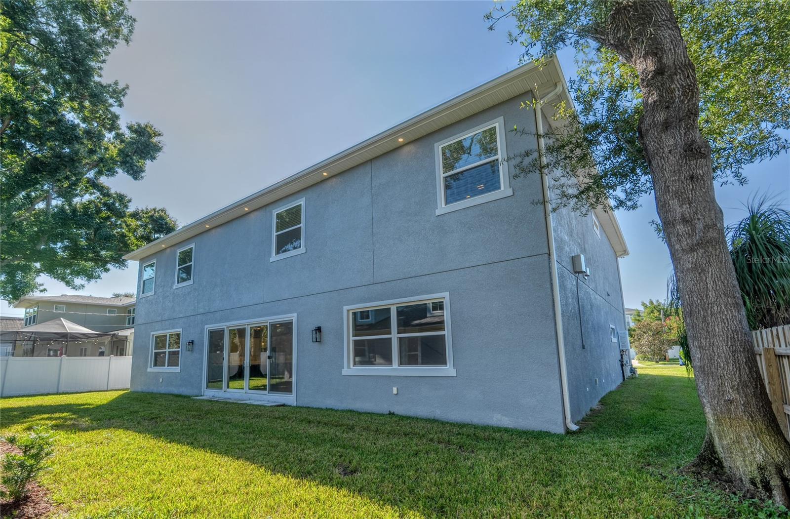 Rear view of main home - windows and doors are double paned and rated to 135 mph