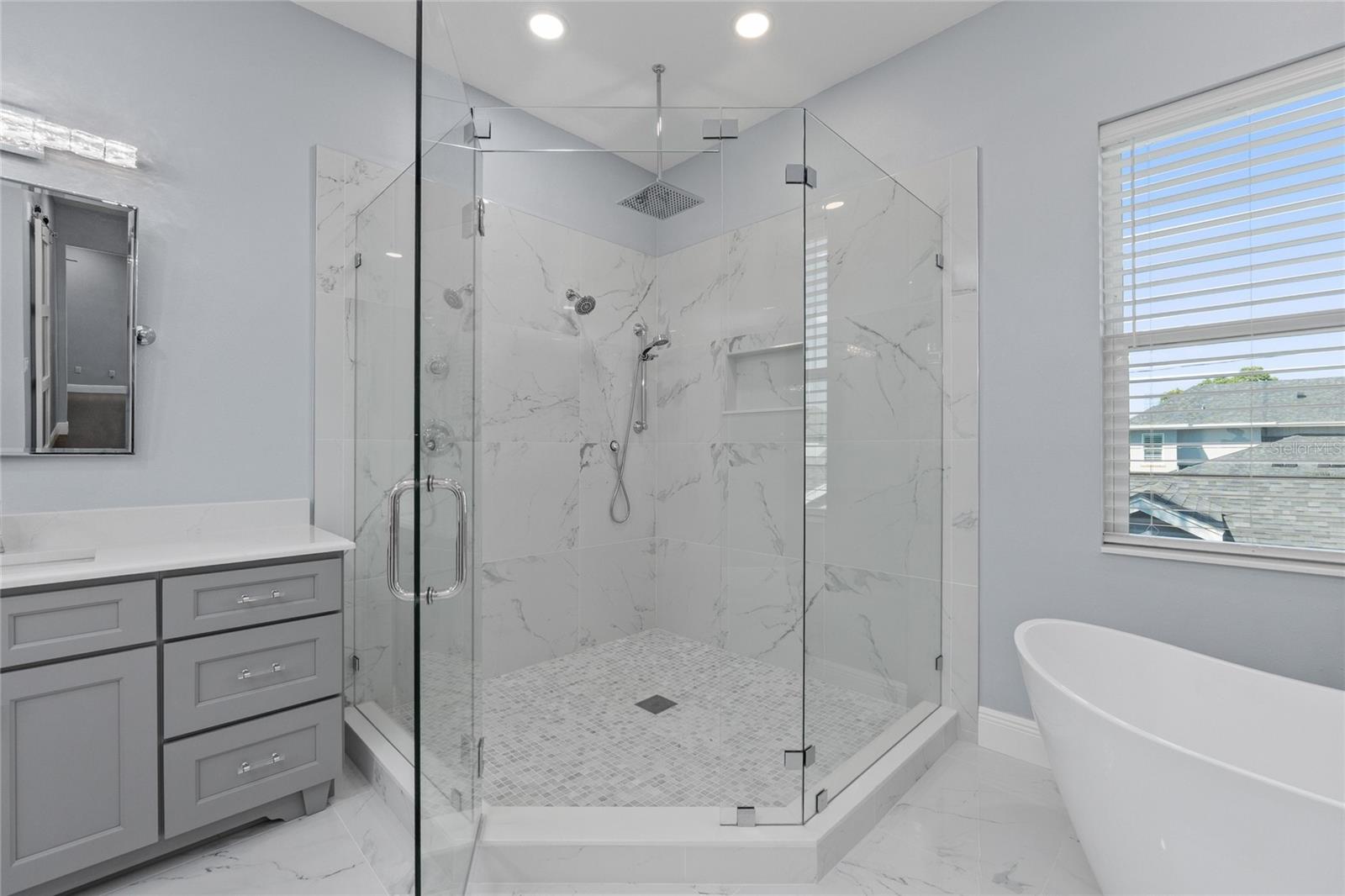 Shower away the stress of the day in this oversized space
