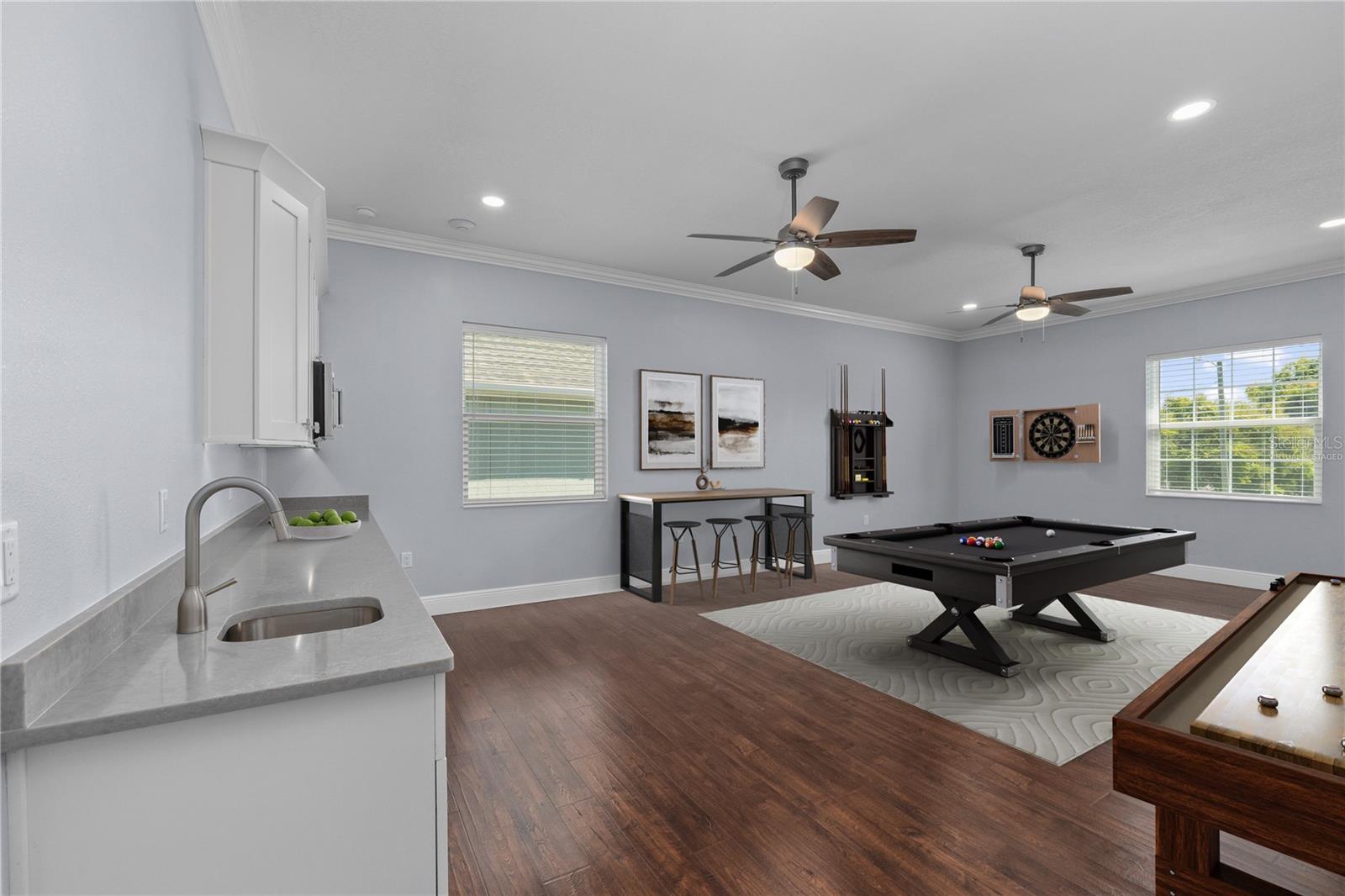 Virtually staged The Bonus Room has endless opportunities with its sink, microwave and fridge