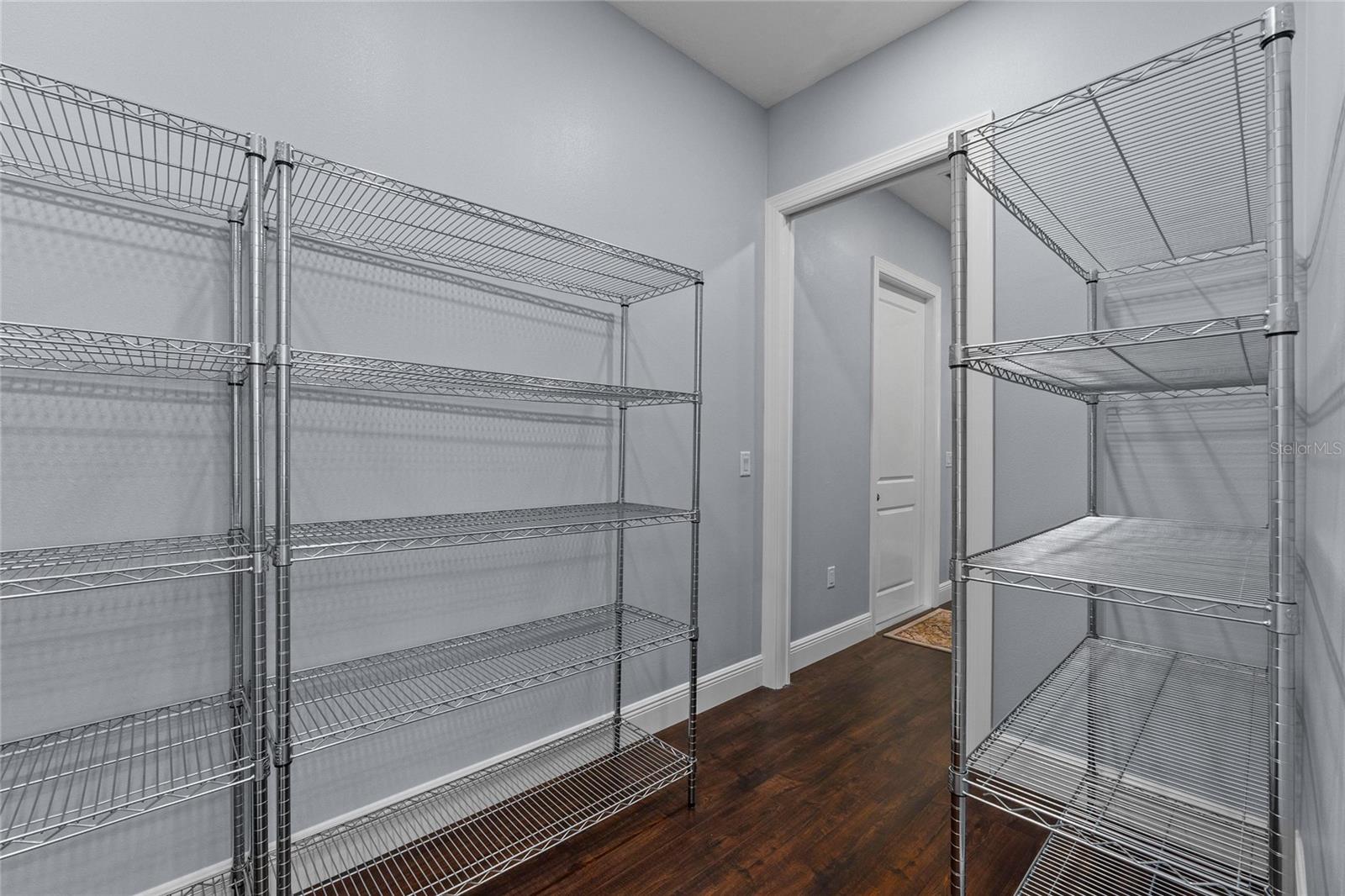 This pantry has so much storage space and it can be accessed from the garage to make shopping runs easier
