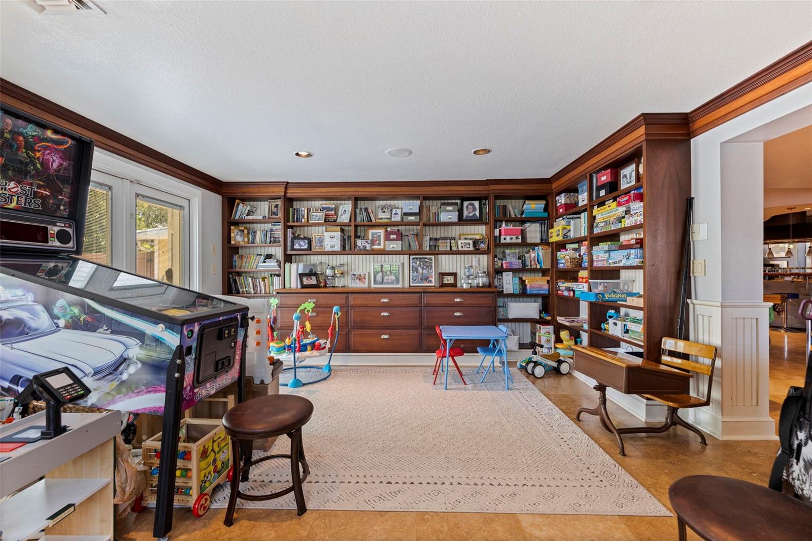 Game/Family room with french doors leading to pool area.