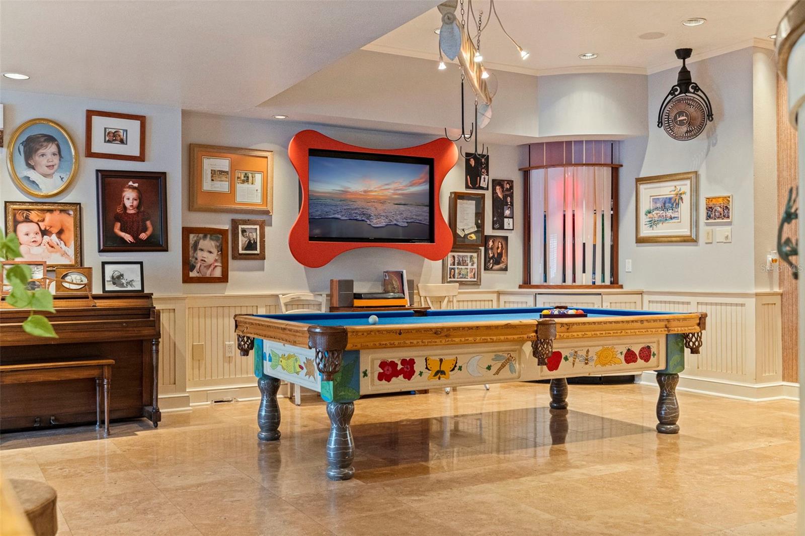 Hidden fridge in cabinet under pool sticks