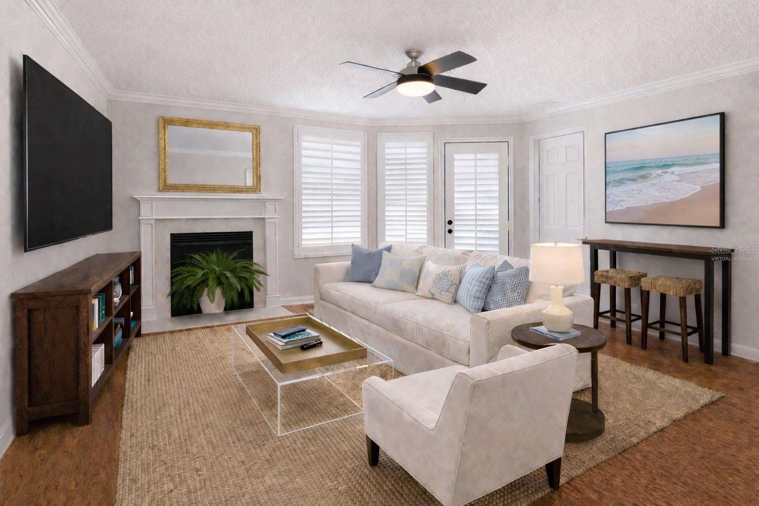 Virtually staged/altered photo to envision a living area furniture arrangement.
