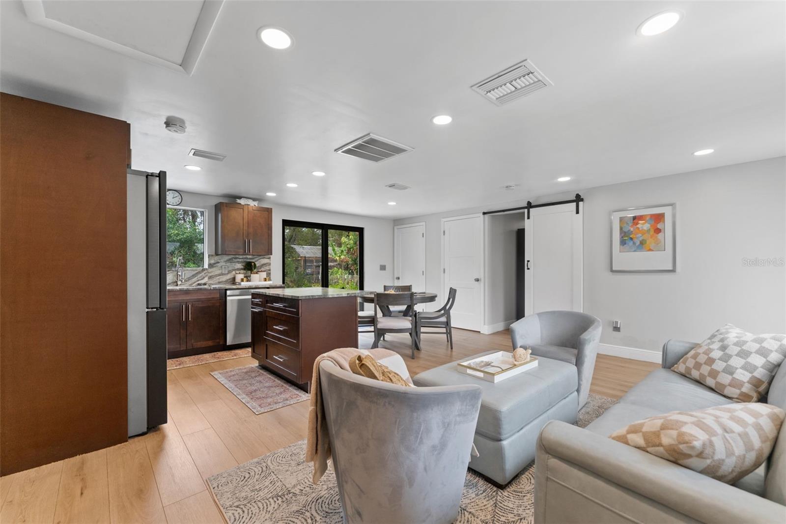 Living room with view of kitchen