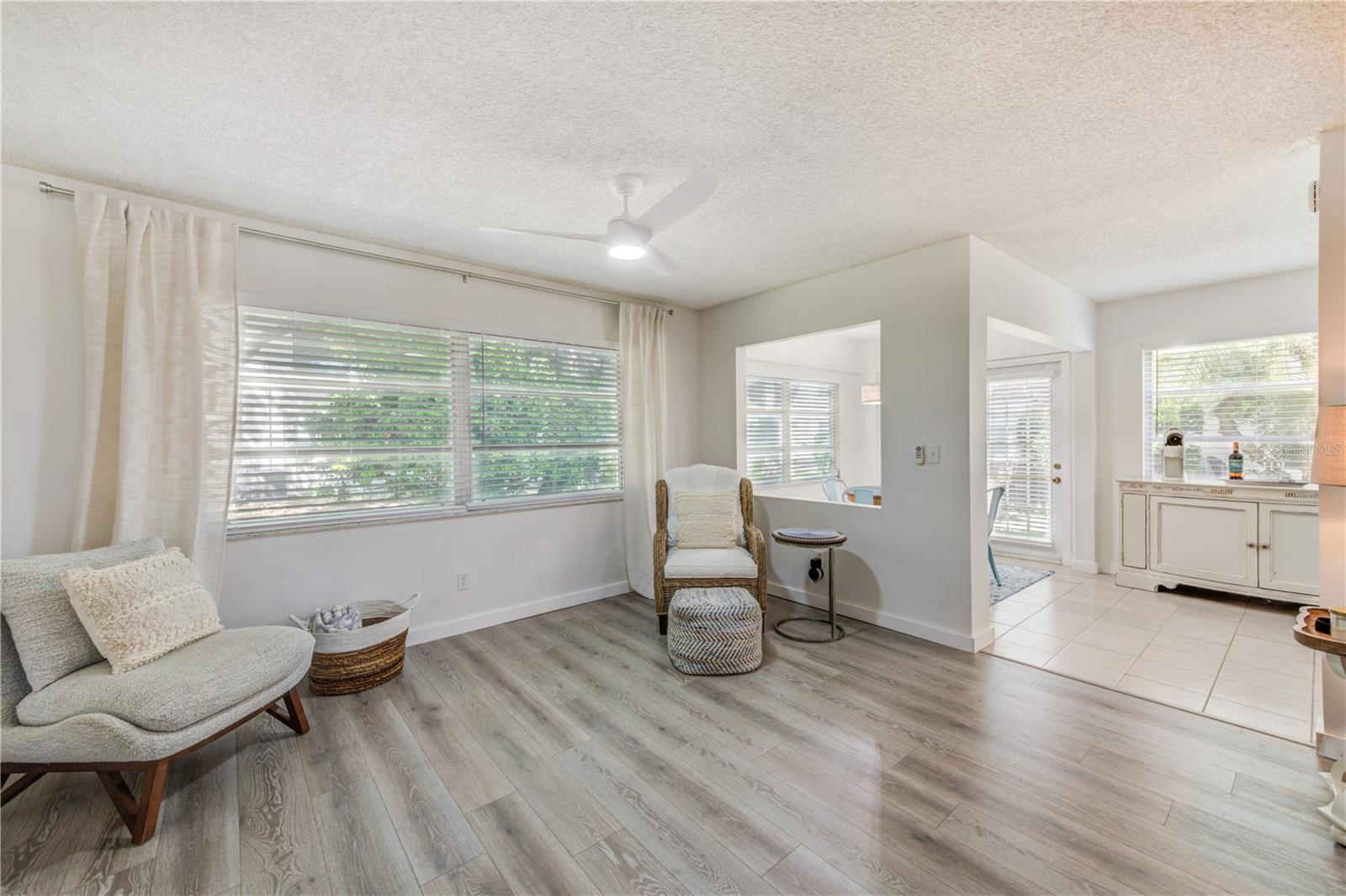 NATURAL LIGHT COMING IN LARGE WINDOWS