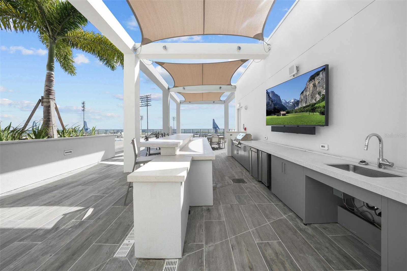 Grill poolside without ever missing a game, thanks to the outdoor TVs!
