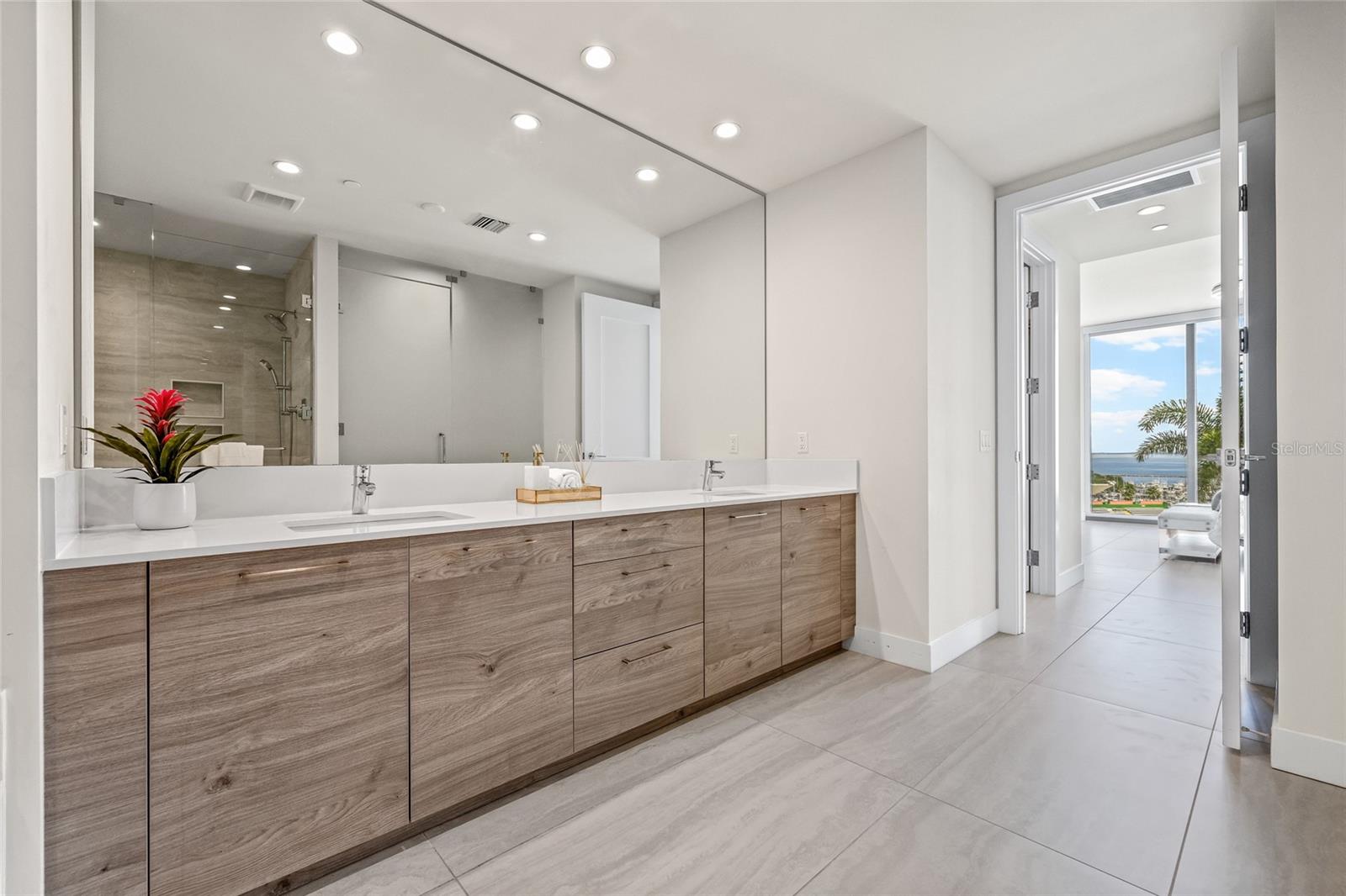 The primary bathroom offers plenty of storage and generous counter space, combining functionality with style.