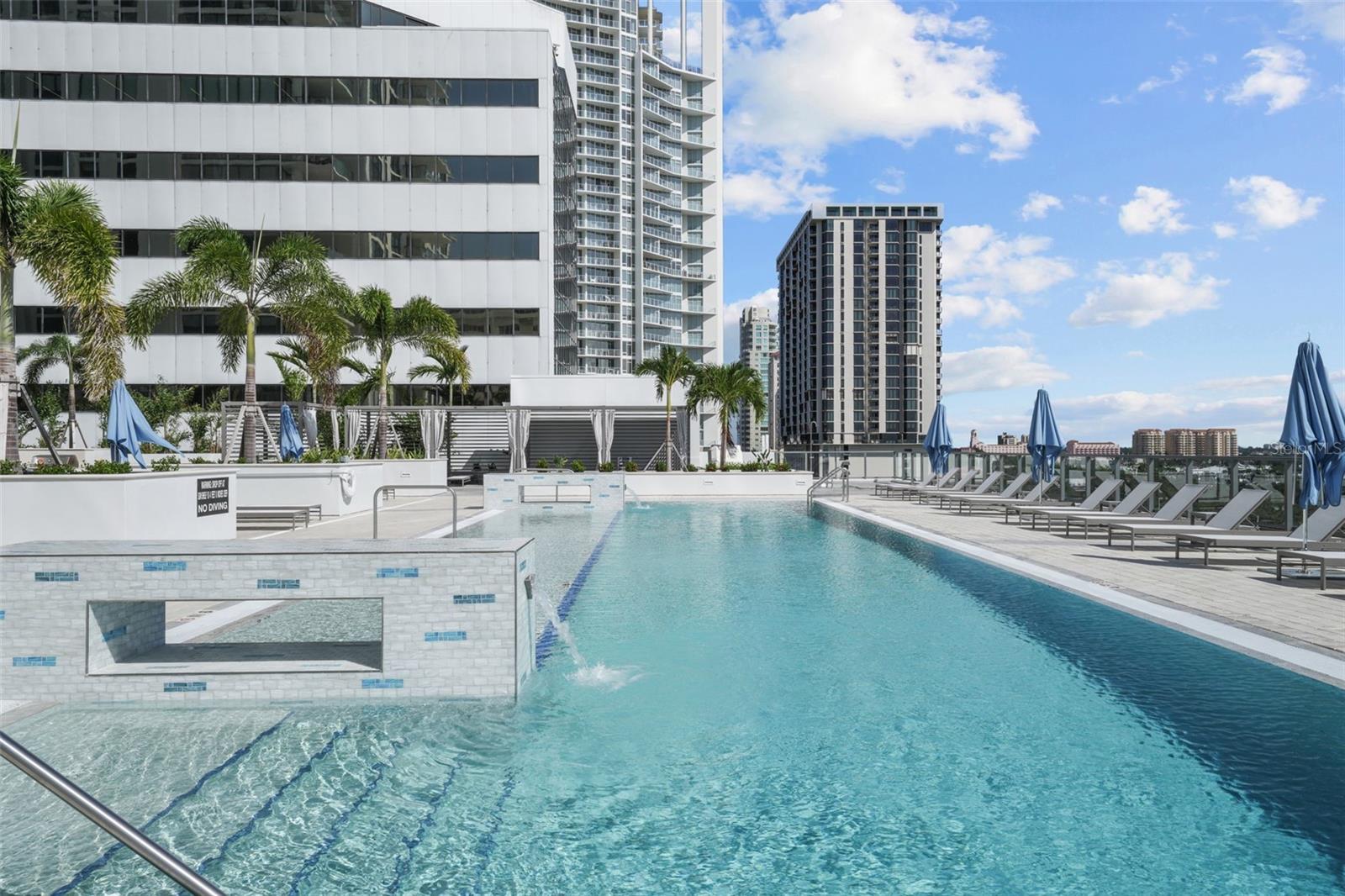 resort-like amenities with water features in the pool.