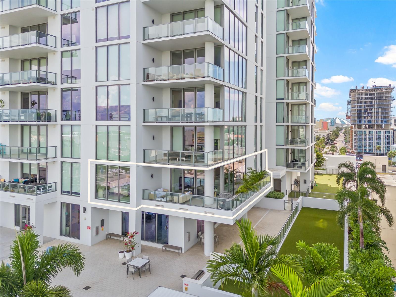 This photo beautifully highlights the extended balcony, where you can enjoy your own tropical garden, just one floor above the amenities level for convenient access.