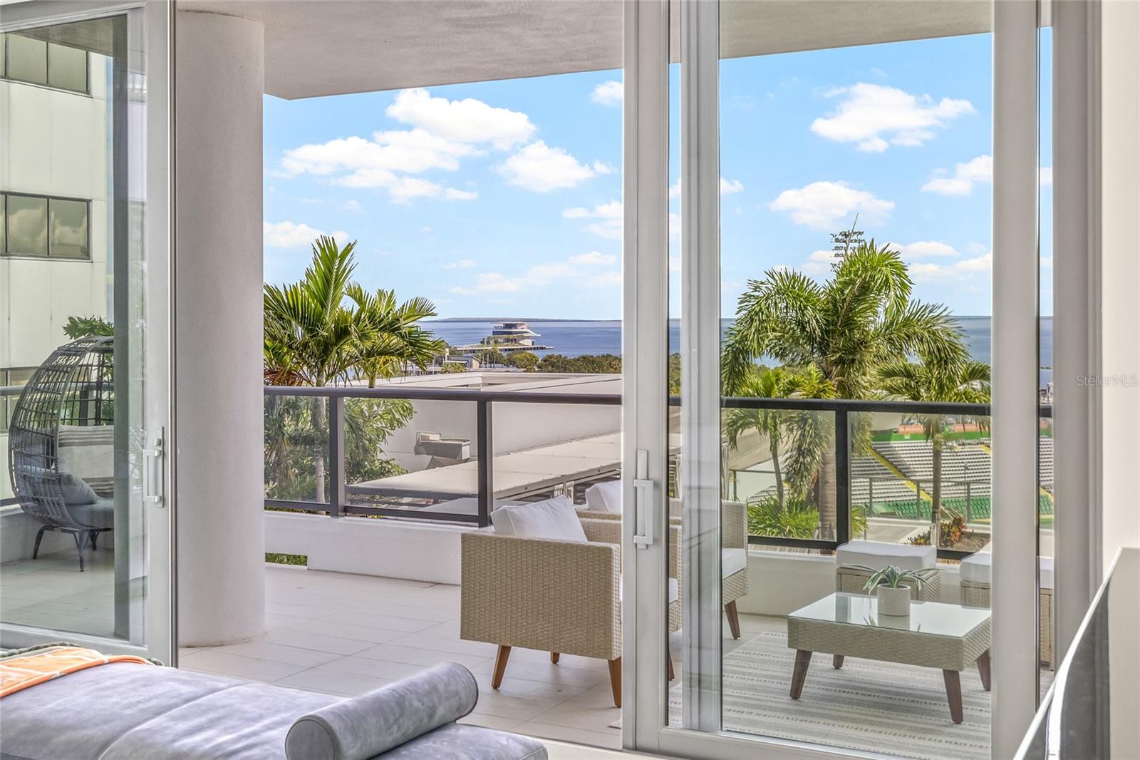 Step outside onto the expansive private terrace—where you can enjoy views of the waterfront, marina, pool, and city skyline.