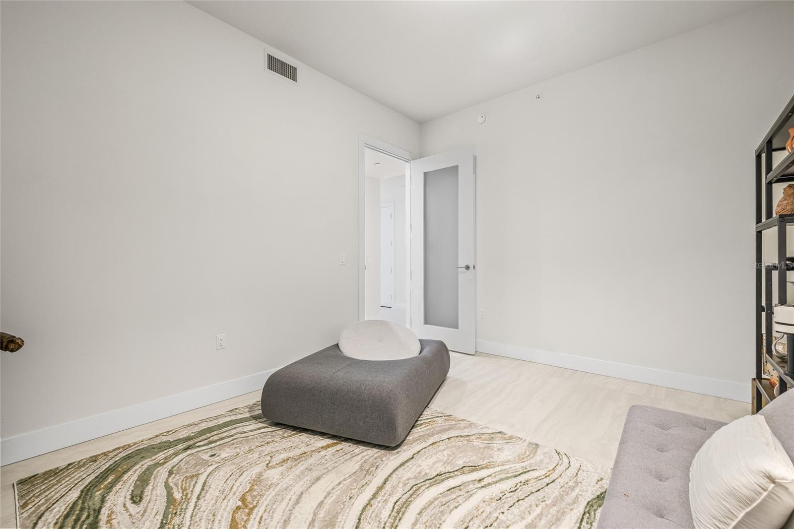 The den is a true bonus room, complete with a door for privacy—ideal as a home office or media room!