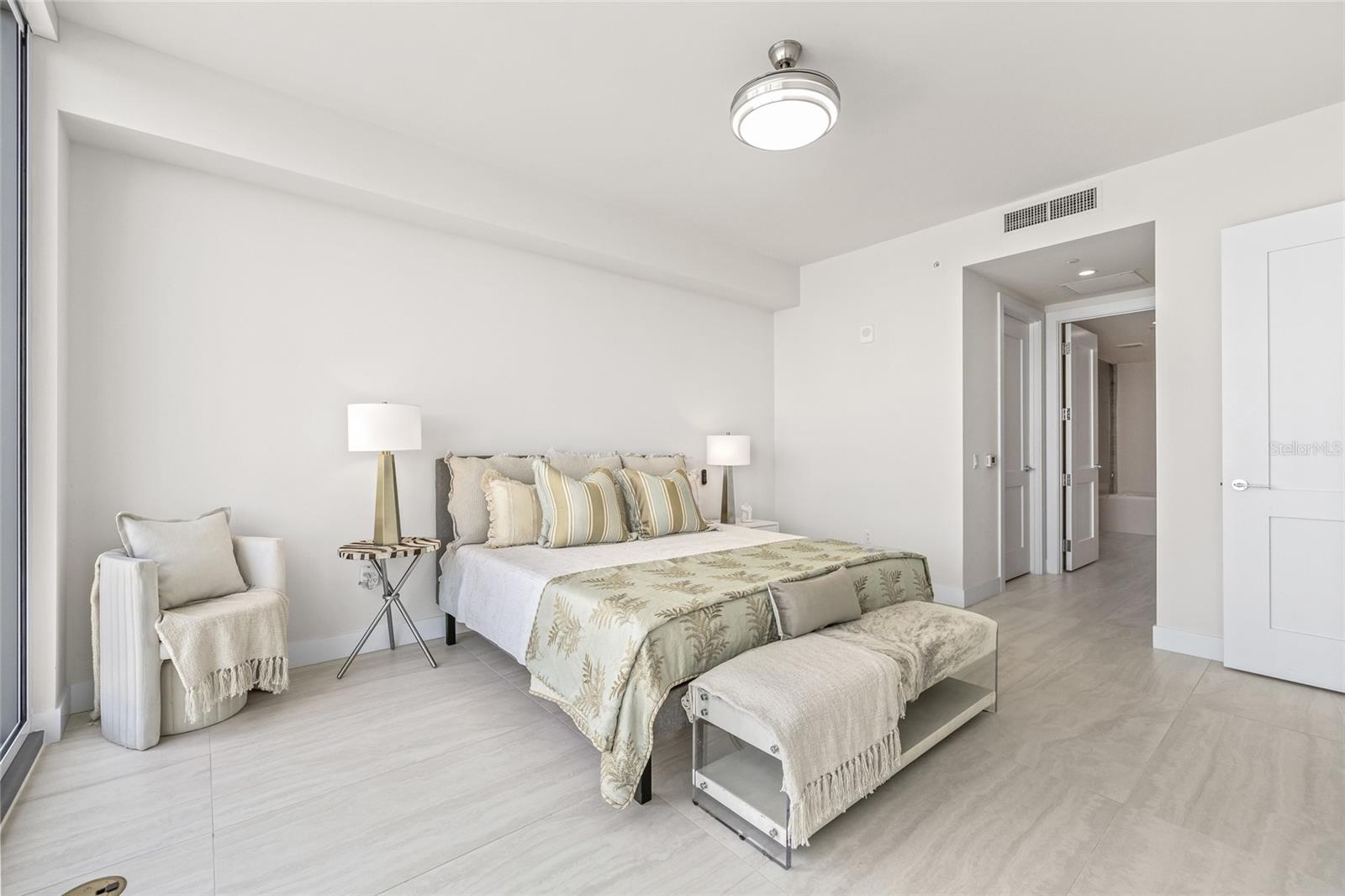 The generously sized primary bedroom features dual walk-in closets in the primary suite with a spa-like primary bathroom.