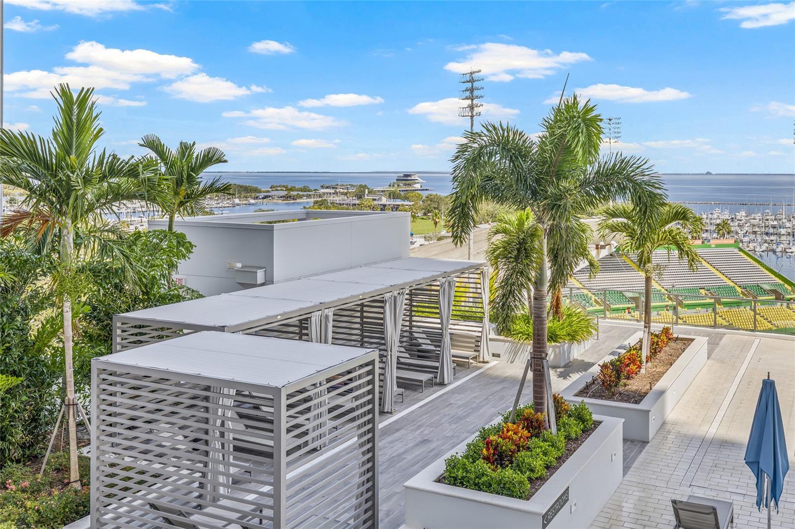 Relax under the cabanas with a good book—the perfect retreat from the sun.