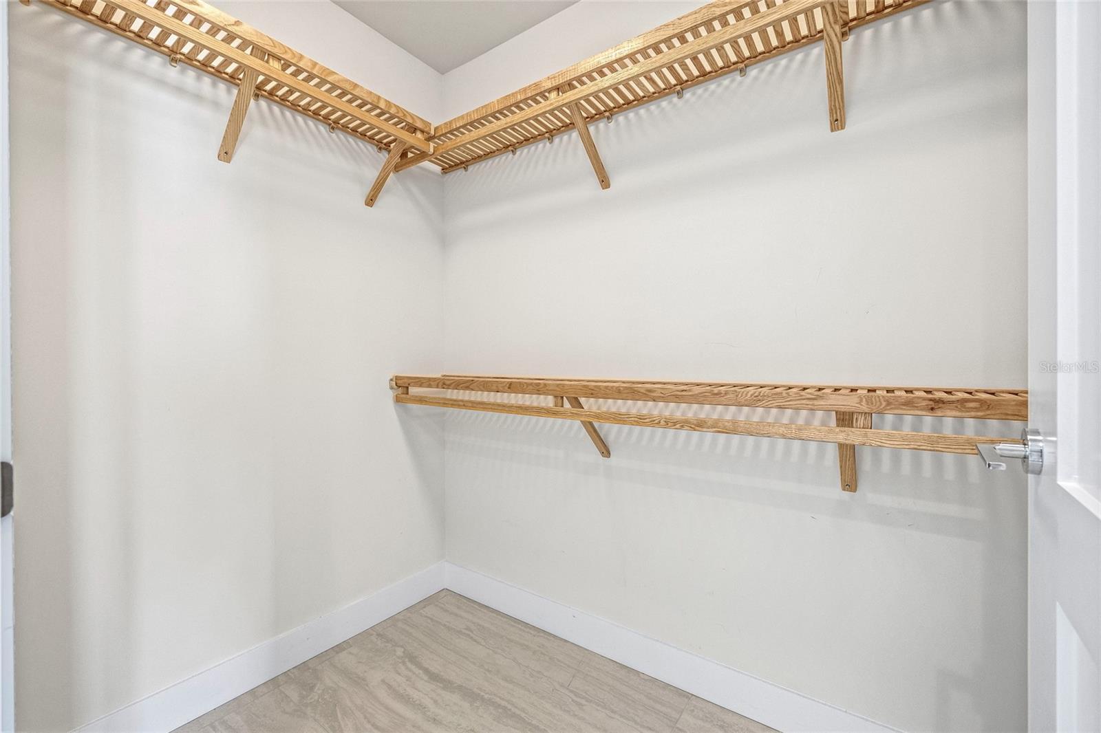 The primary bedroom includes a walk-in closet with built-ins.