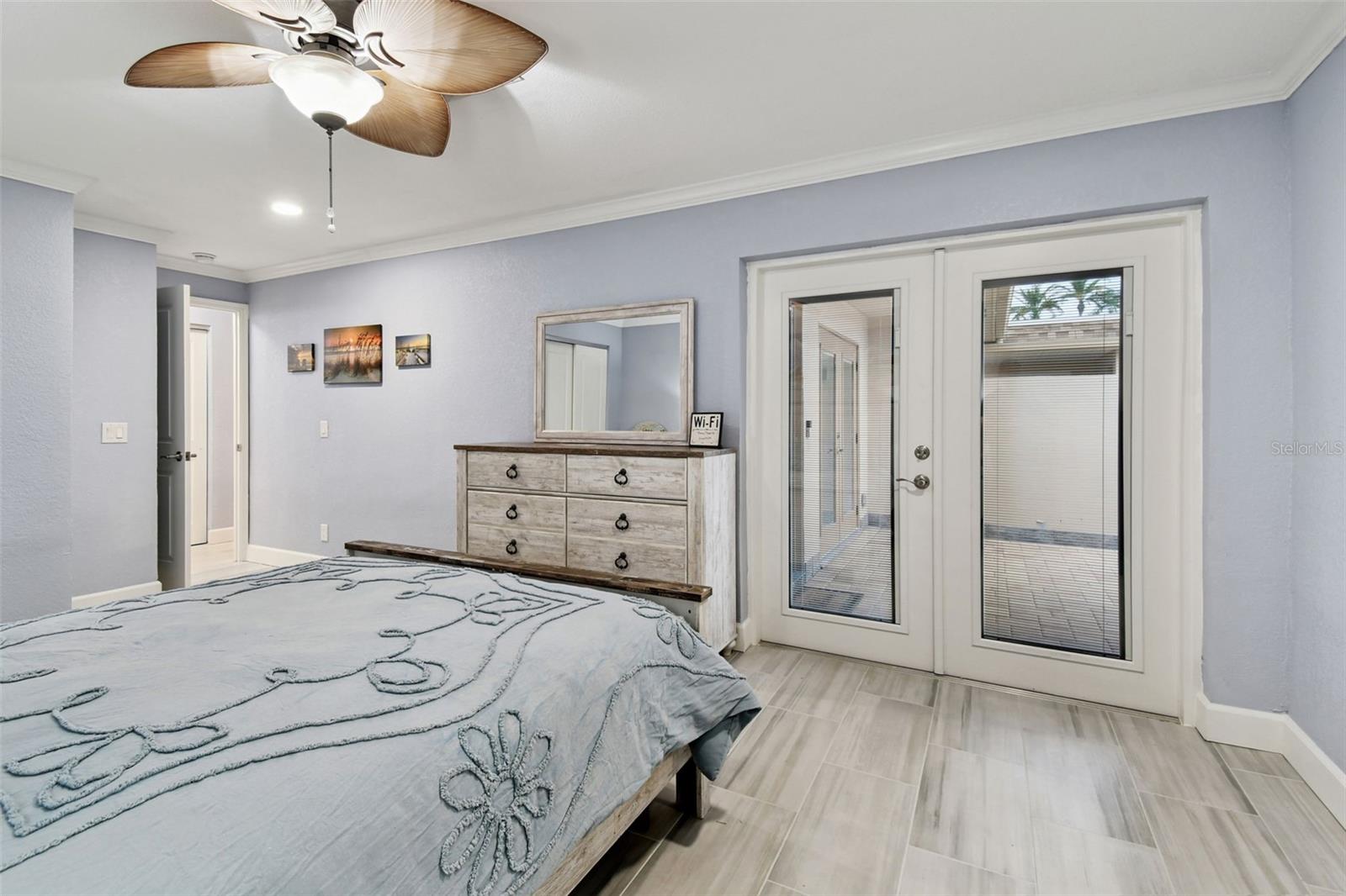 Guest bedroom doors with insulated blinds protected by the glass, these blinds never need cleaning or dusting.