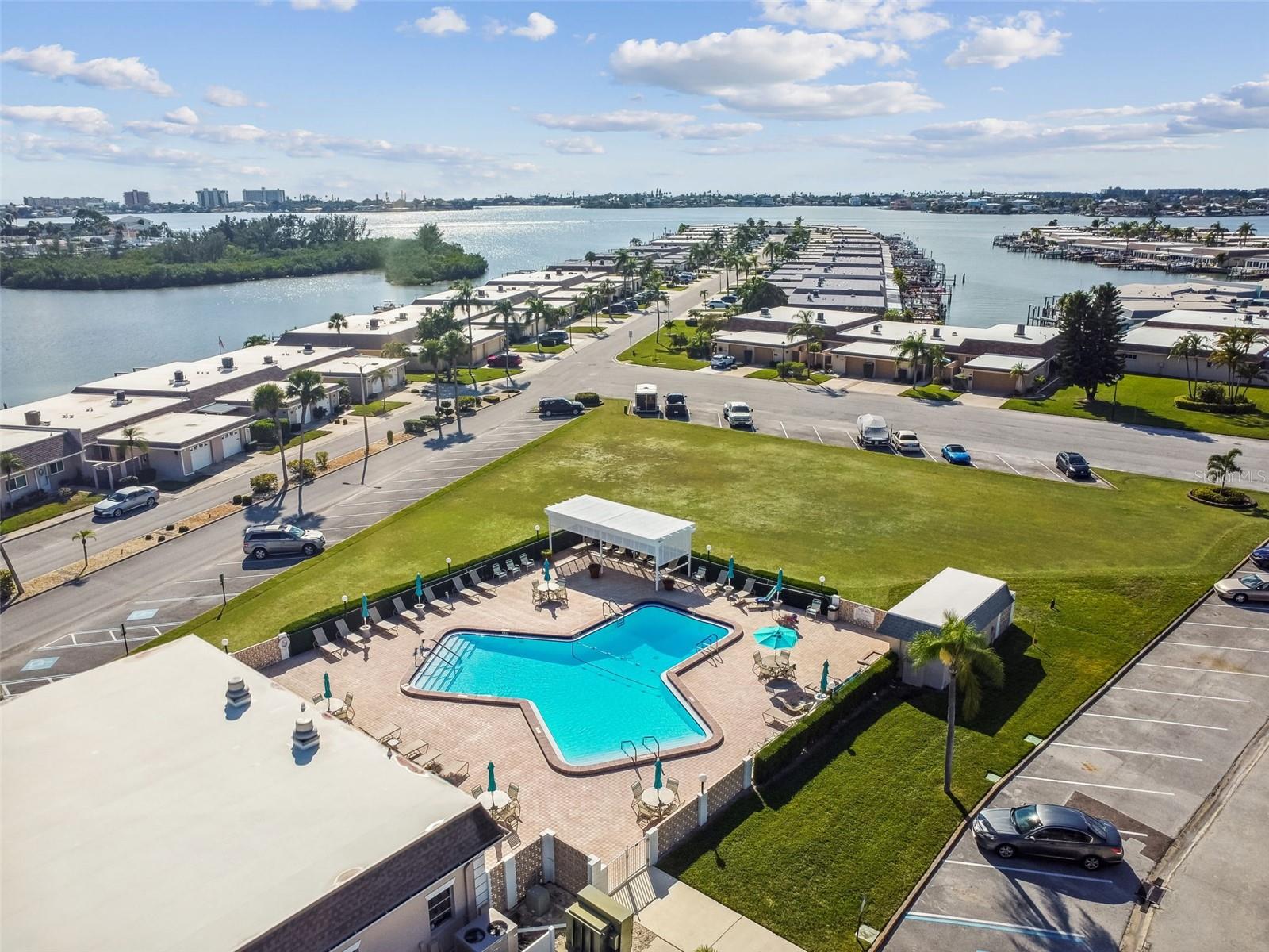Aerial photo of clubhouse and pool, conveniently located across the street from 334 Boca Ciega Point Blvd.