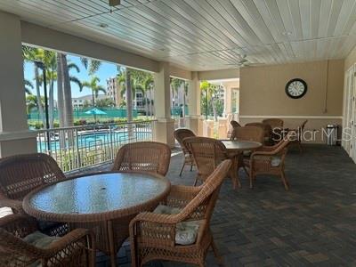 Covered seating area overlooking the pool