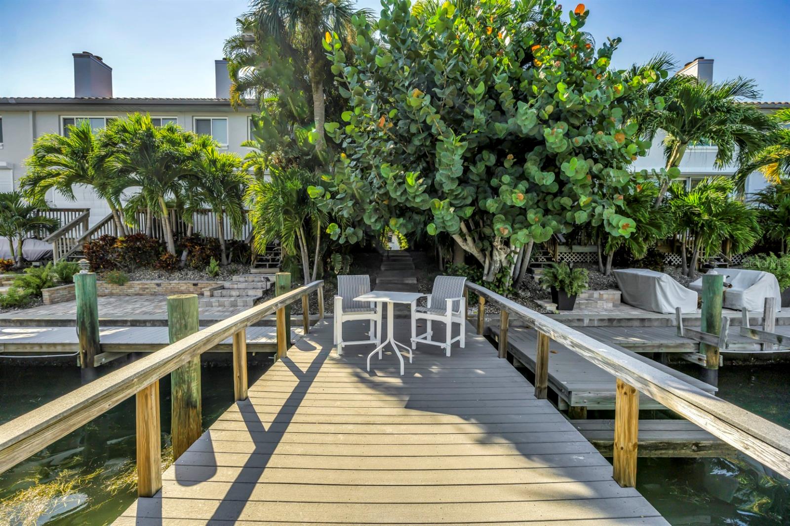 Lush Landscape and Private Community Dock Await