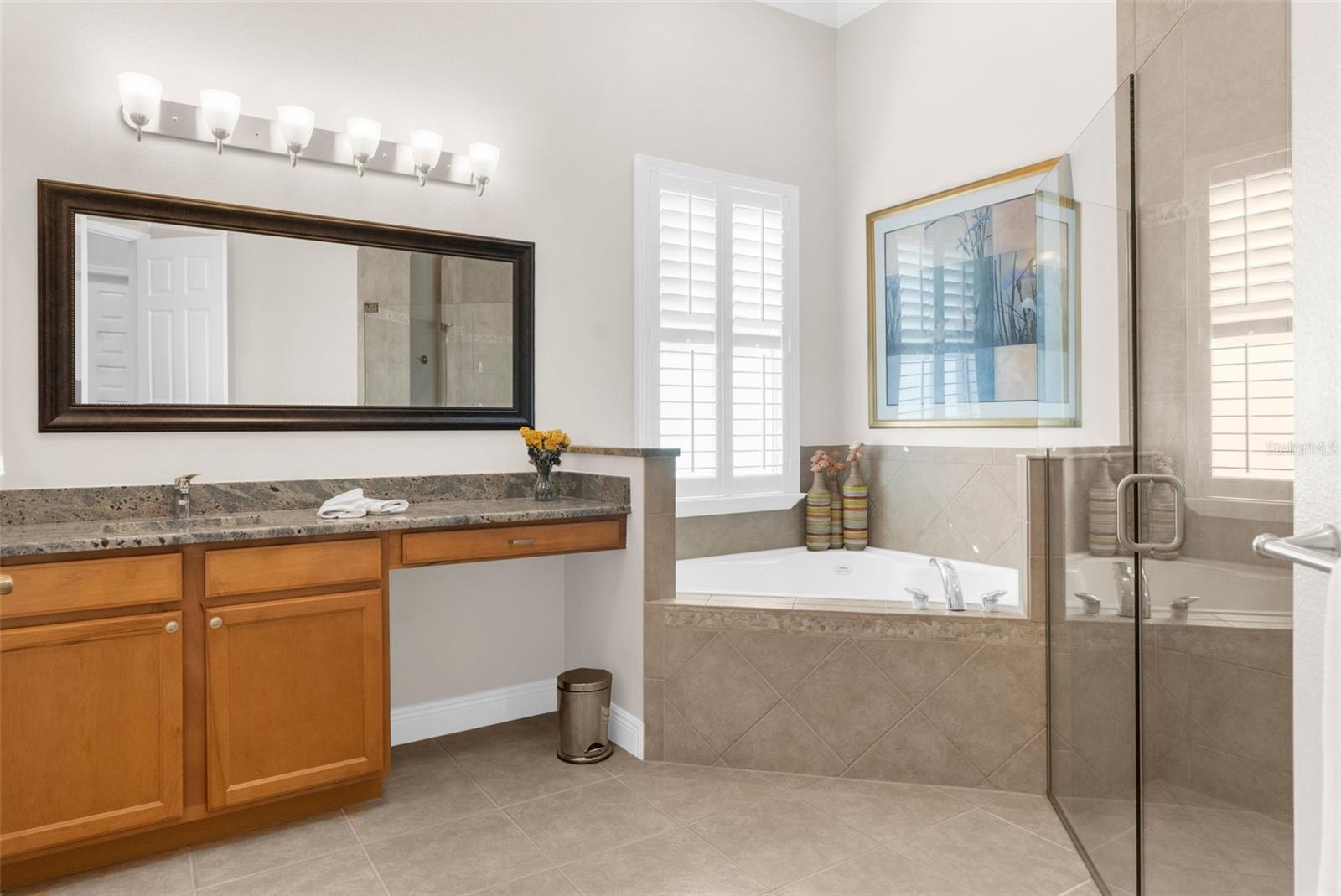 Master suite: "Her" bath area with shower, soaking tub, "her" large private clothe closet.