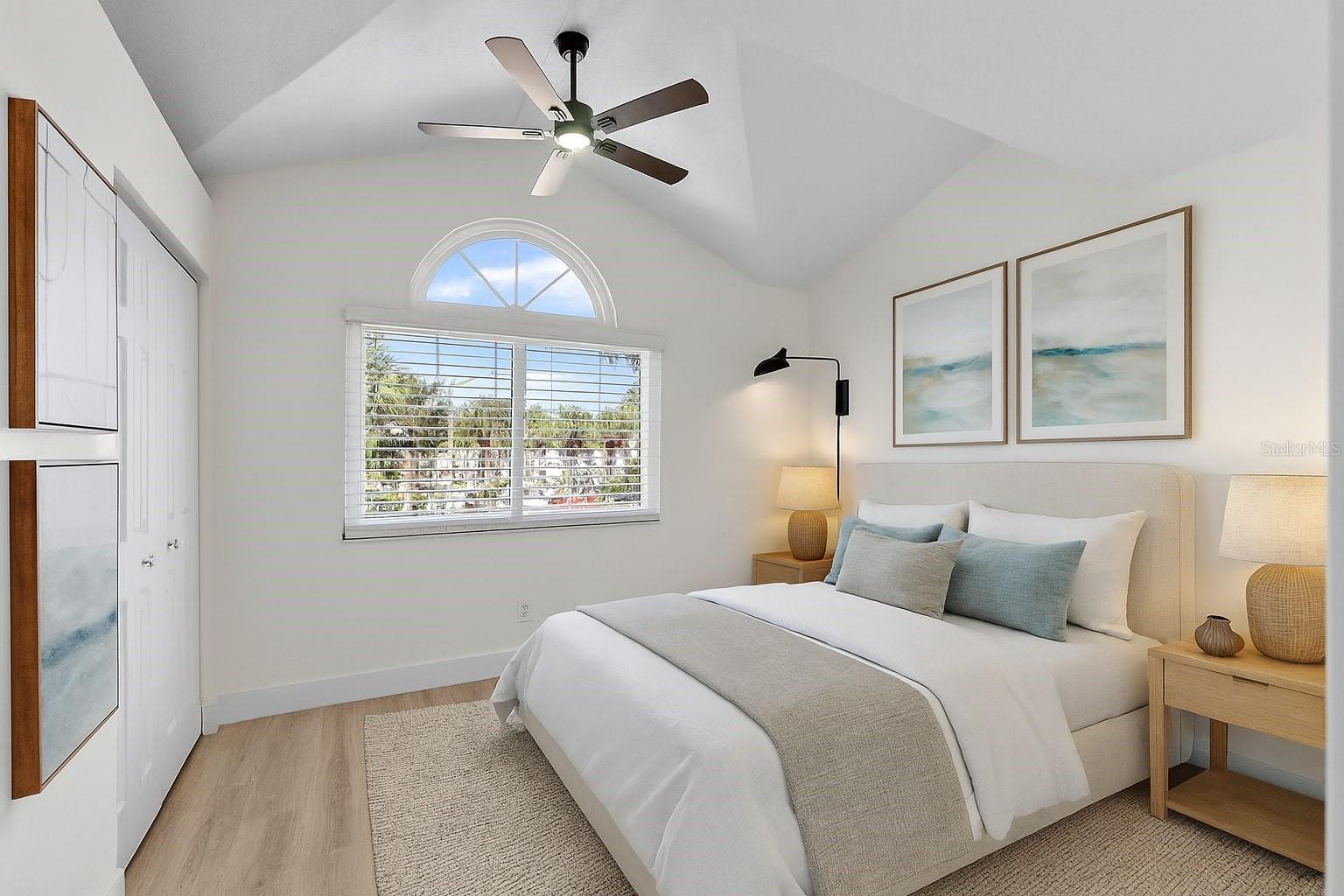 Soaring ceilings in this light filled guest room.