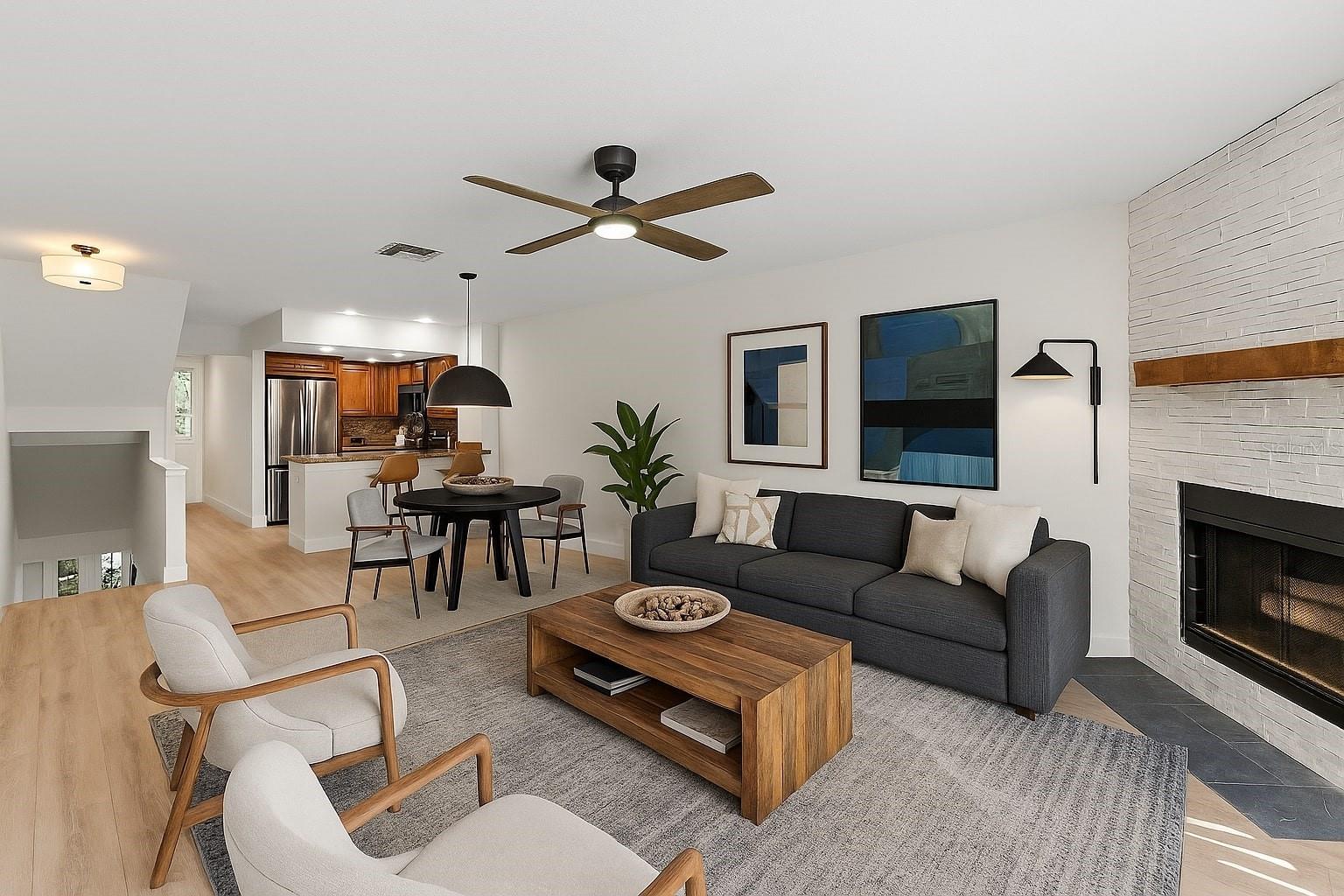 Loads of light surrounds this cozy fireplace and living area.