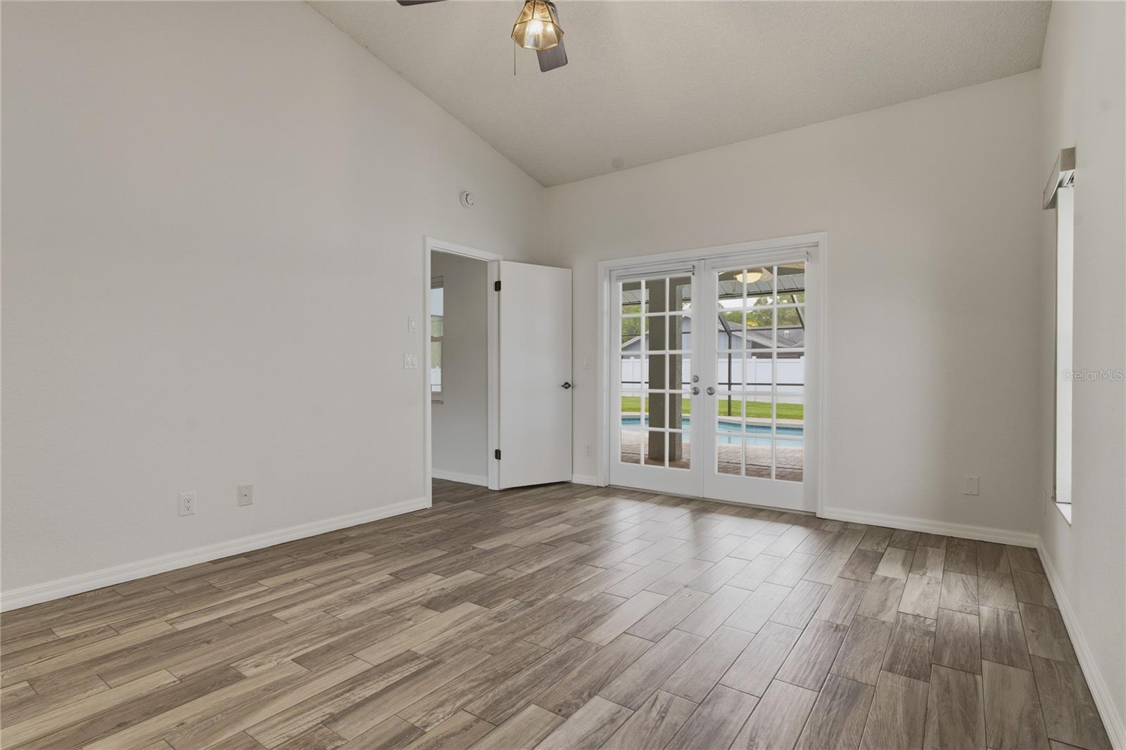 Primary Bedroom to Pool and Lanai View