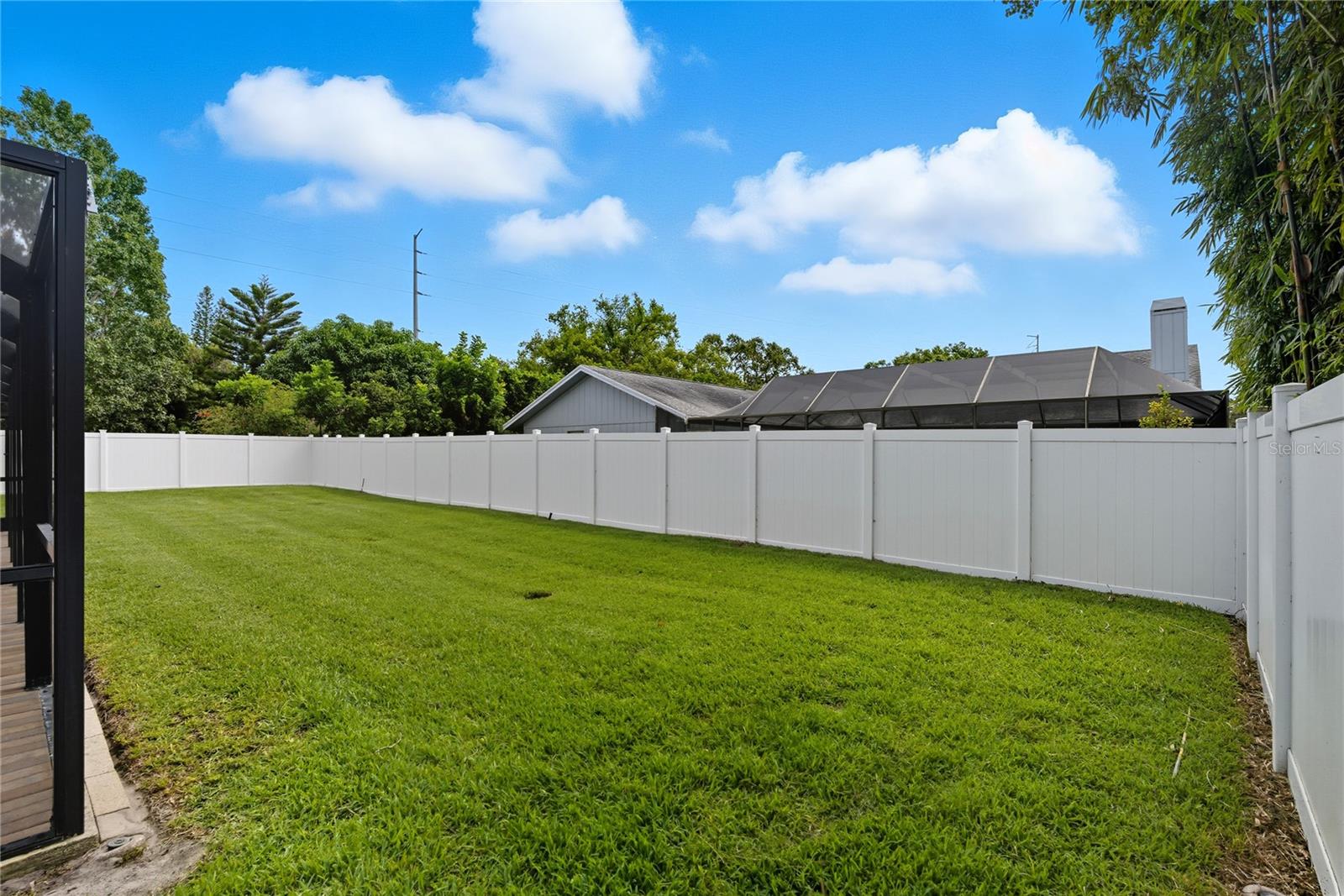 Fenced Backyard View 4