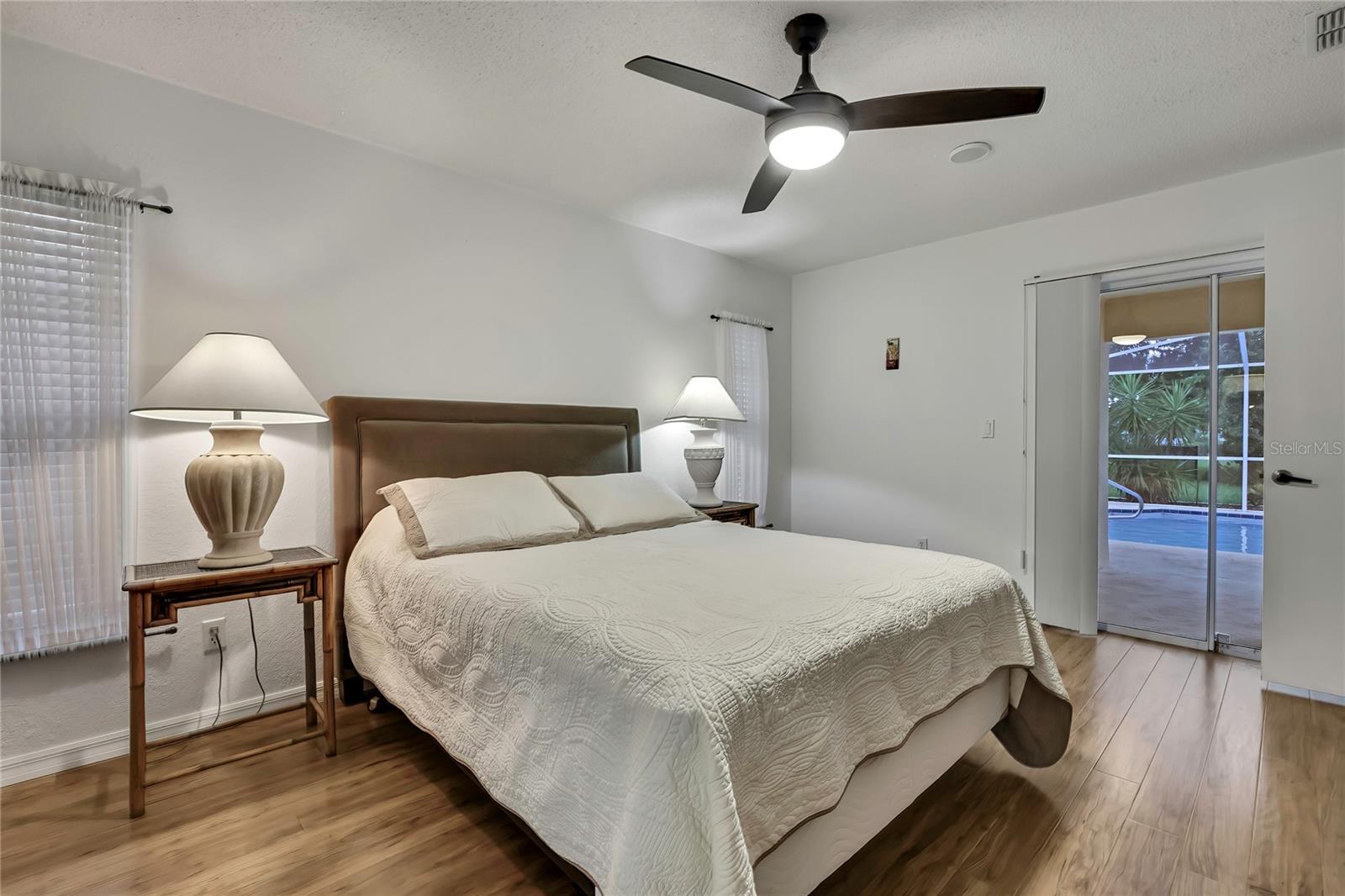Primary bedroom has a sliding door to pool area.