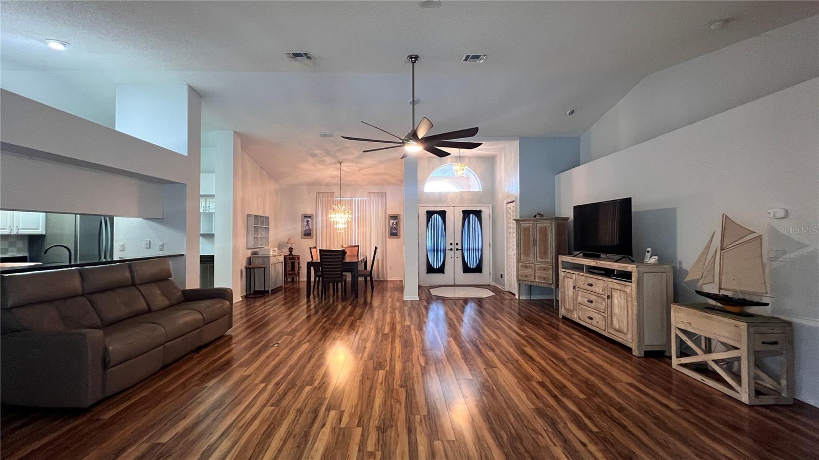 Great room front entrance doors and dining room on the left