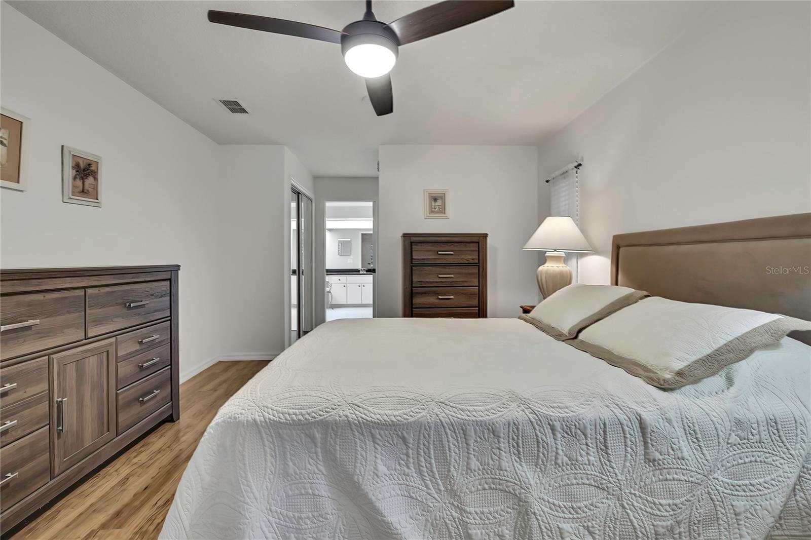 Large comfortable split bedroom plan primary bedroom.